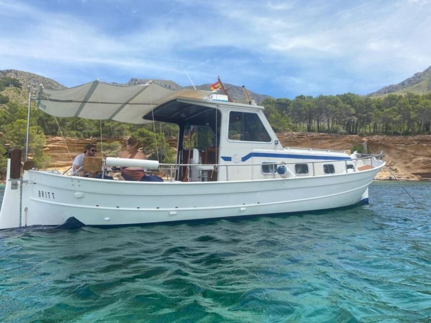 Alcudia: Private Sunset Boat Trip with Glass of Wine & Snack - Cruising Alcúdia Bay toward Aucanada Island