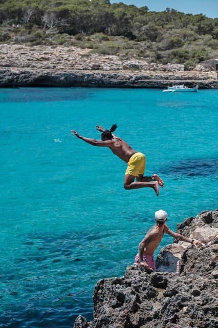 Experinence Cala Agulla / Molto with Paddlesurf and snorkel - Cala Agulla: golden sand, pine views, and real beach freedom