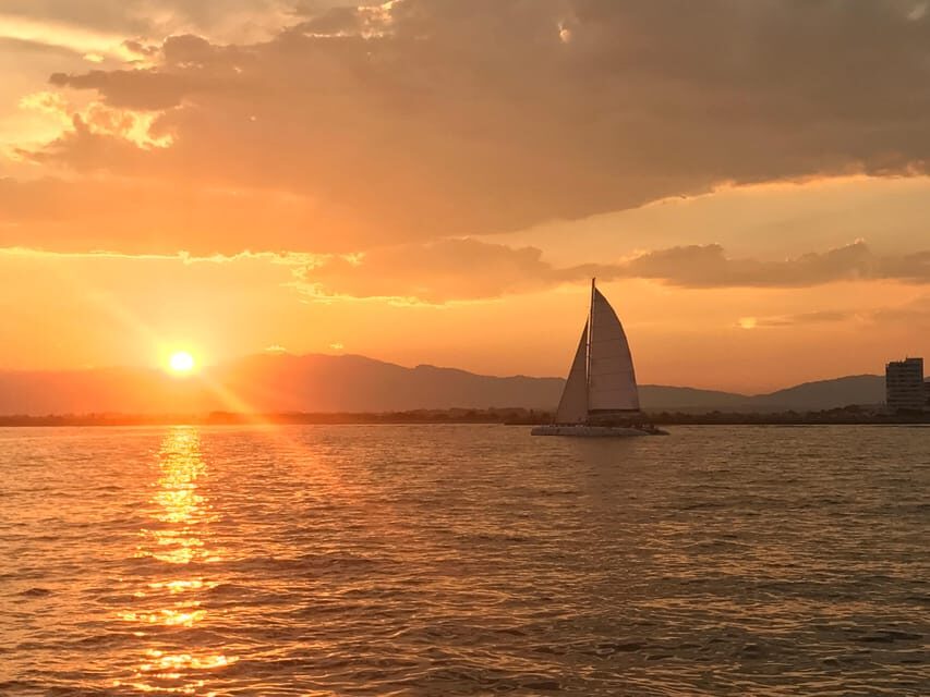 Palma de Mallorca: Sunset Sailing Catamaran Trip with Drink - Snacks and the Onboard Mood: Small Bites, Big Relaxation