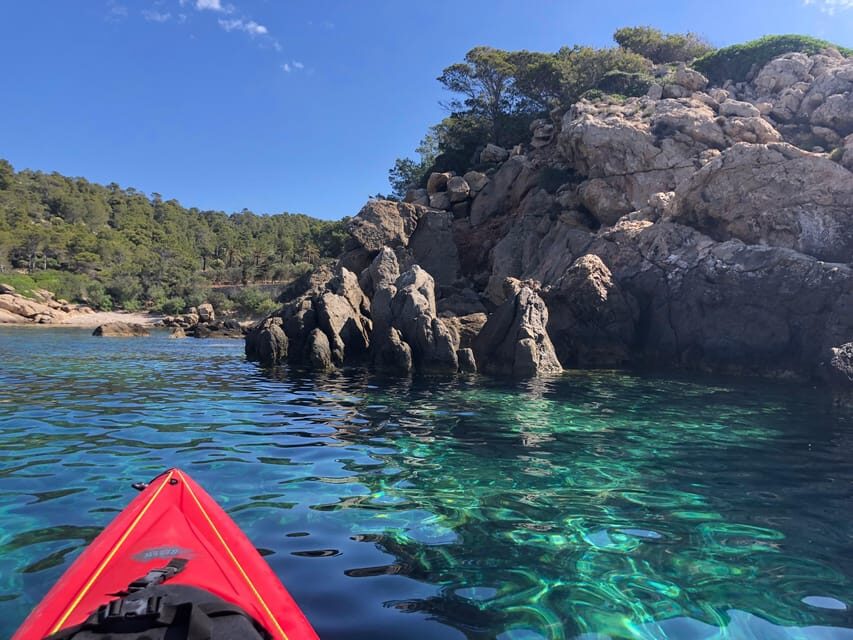 Sant Elm: Guided Kayak Sunset Tour with Picnic in a Cove - The quiet cove swim and snorkel: why water access changes everything